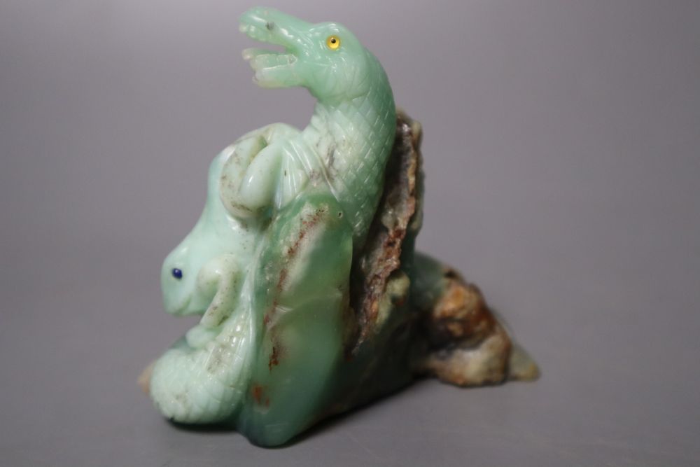 A Chinese jadeite carving of a toad and a serpent, 7.1cm high, with glass and lapis lazuli inset eyes